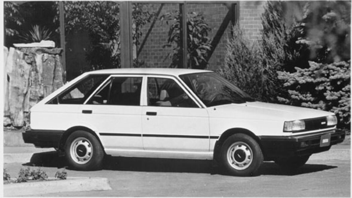 1988 Nissan Sentra in black and white parked outside.