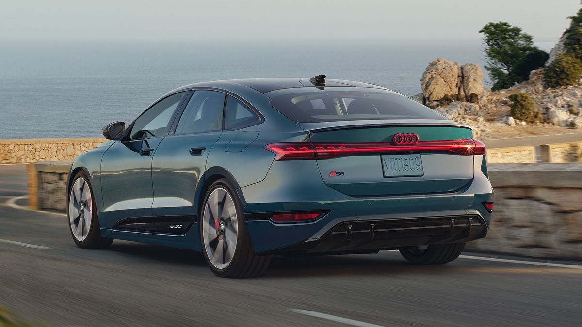 2025 Audi S6 Sportback e-tron driving on a road near the ocean.
