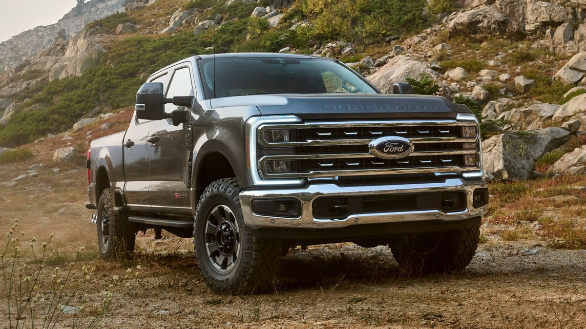2025 Ford F-250 Super Duty parked in front of rocky mountains.