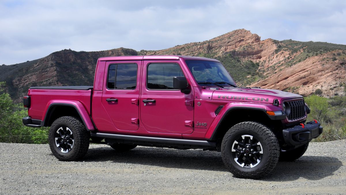 2025 Jeep Gladiator Rubicon parked on a dirt road with red hills in the backgound.
