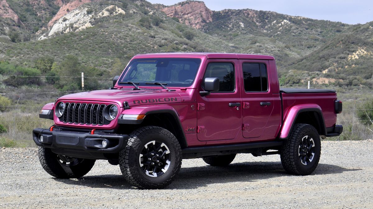 2025 Jeep Gladiator Rubicon parked on a dirt road with red hills in the backgound.