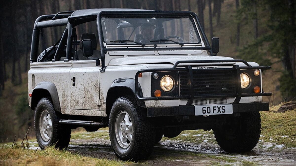 1997 Land Rover Defender on grassy roads.