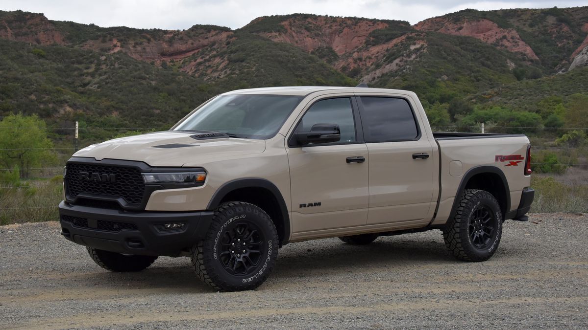 The 2025 Ram 1500 Rebel in buff seen from a front quarter angle