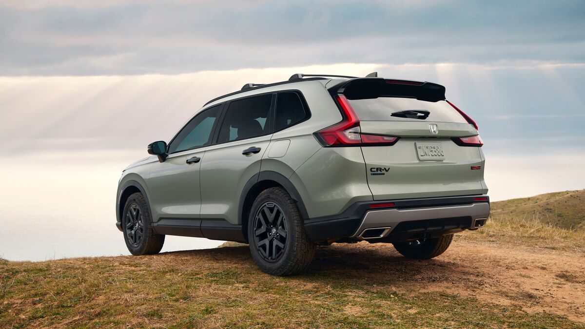 The 2026 Honda Passport TrailSport hybrid seen from a rear quarter angle