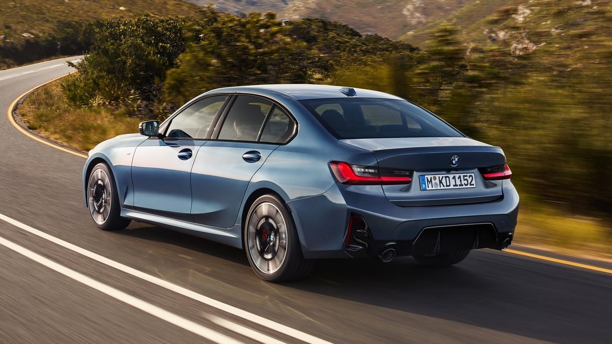 2025 BMW 3 Series driving on a curved road.
