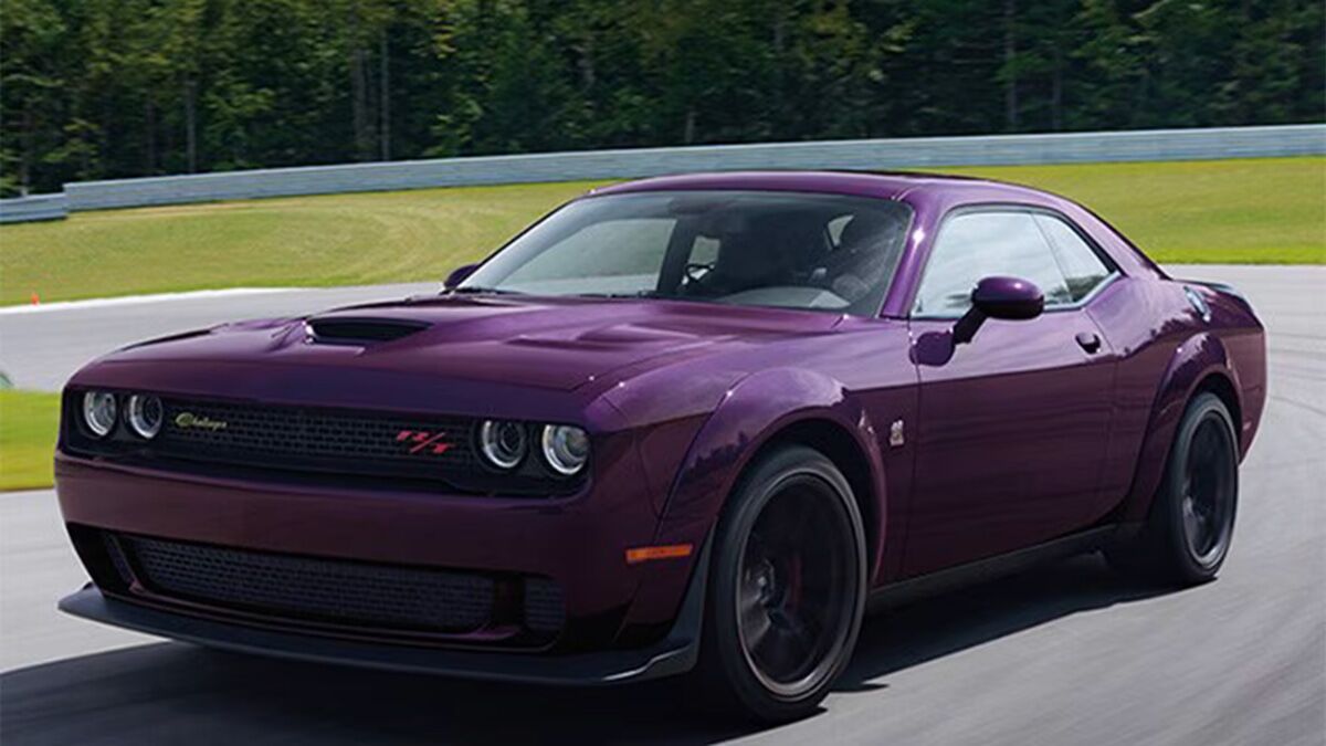 2012 Dodge Challenger in purple on the road.
