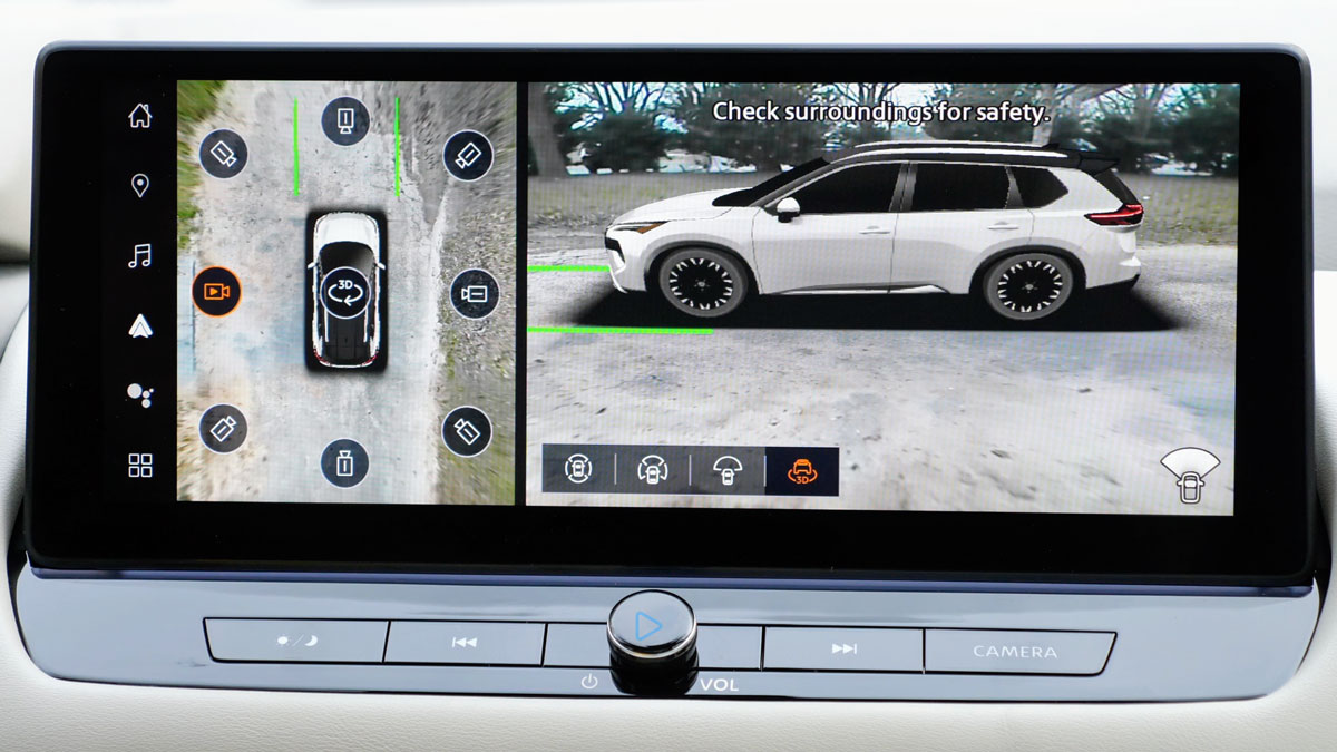Center screen split into a top-down view of an SUV with its surroundings on the left and a side camera view of the SUV on the right.