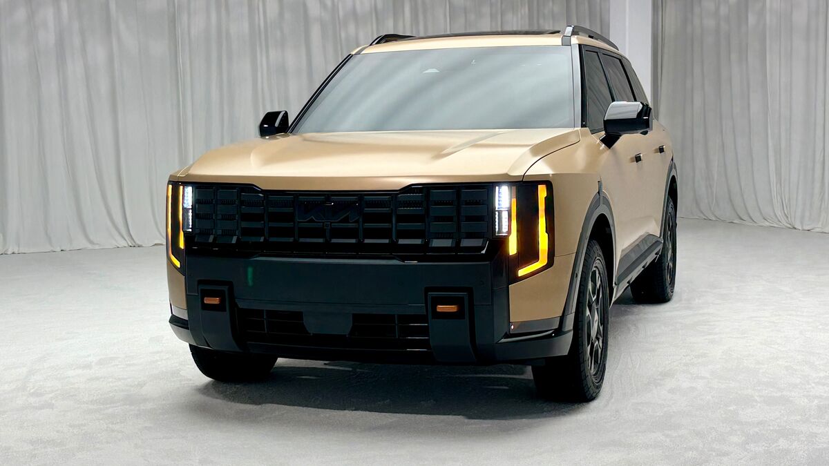 The 2027 Kia Telluride X-Pro in khaki seen from a front quarter angle