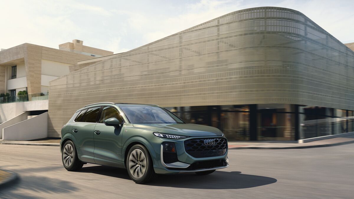 The 2026 Audi QS3 in green seen from a front quarter angle