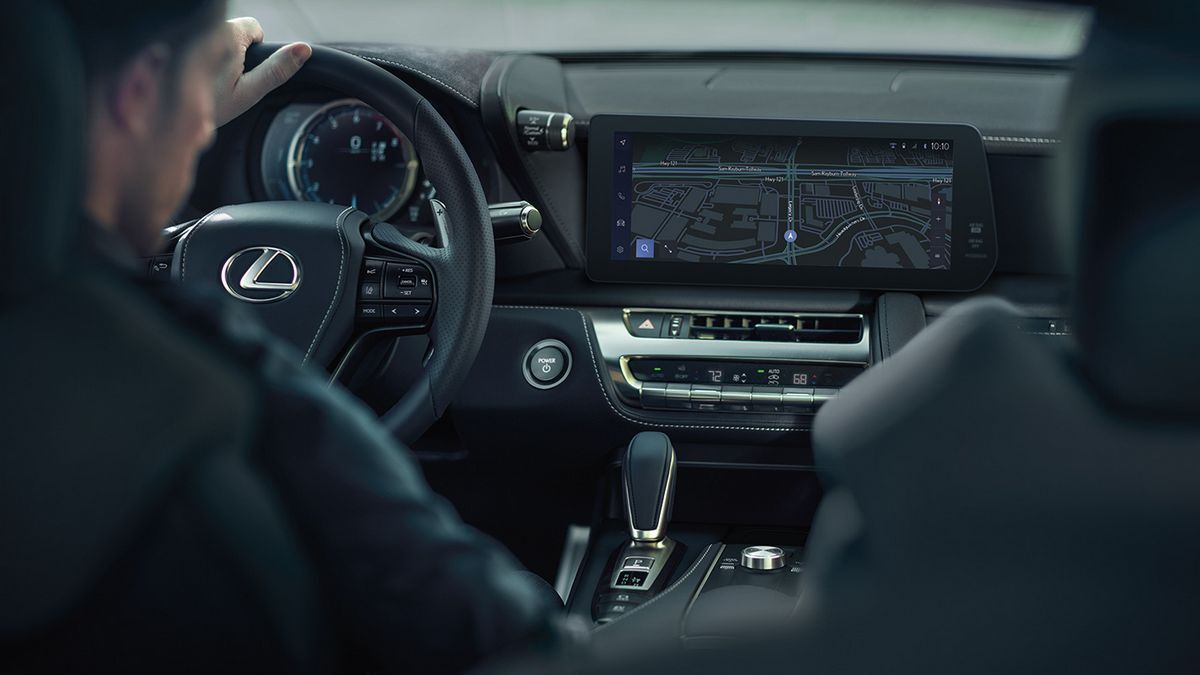 2025 Lexus LC driving on a curvy road.