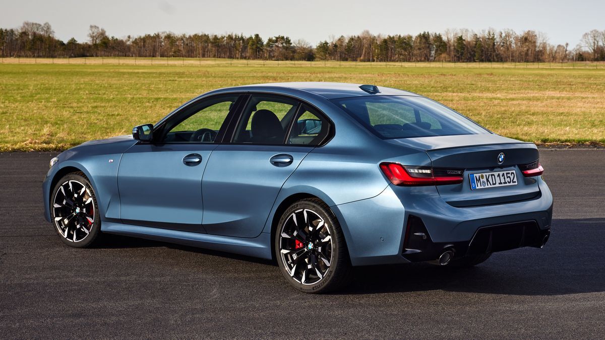 2025 BMW 3 Series parked near a grass field.