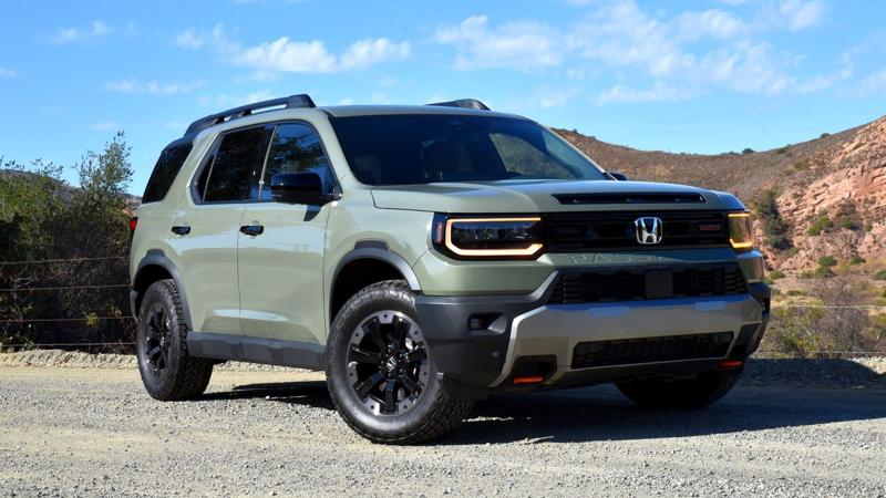 2026 Honda Passport TrailSport with red hills in the background.