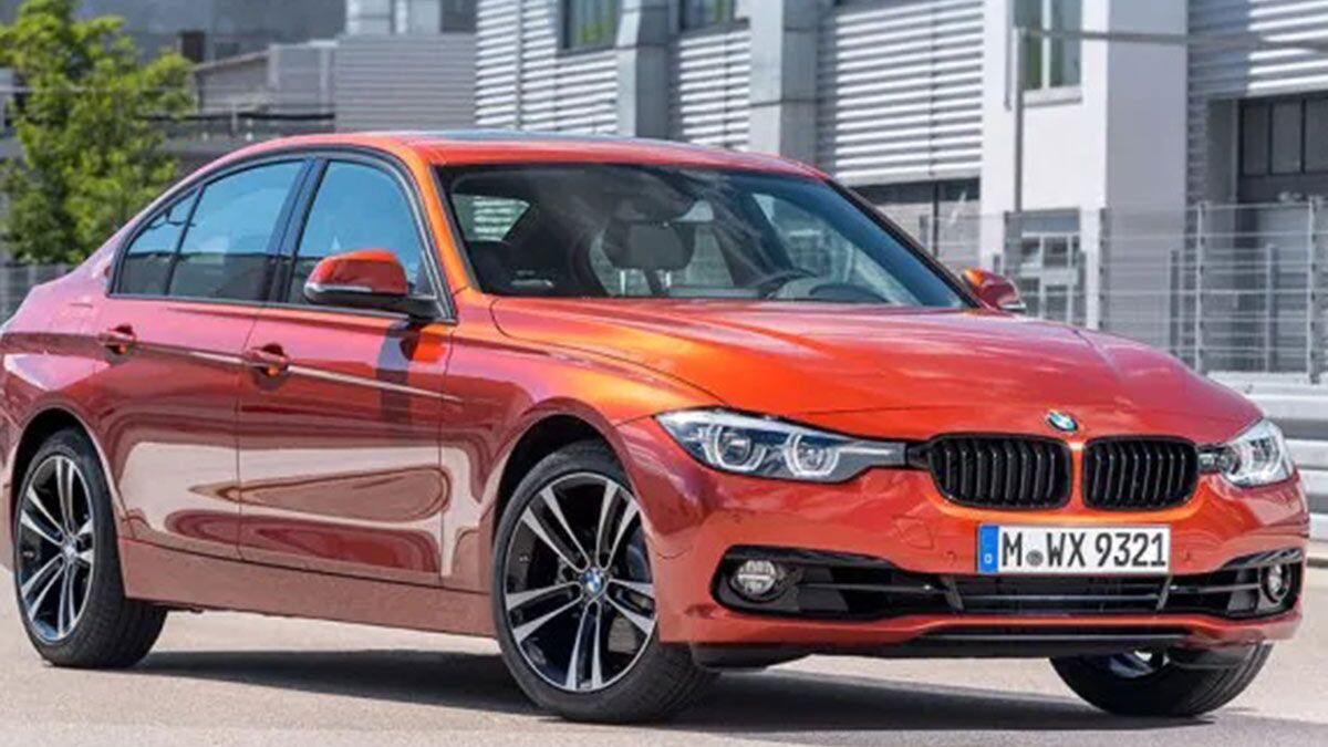 The 2018 BMW 3 Series in orange seen from a front quarter angle