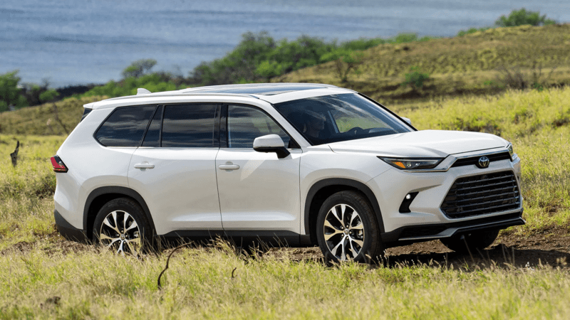 2026 Toyota Grand Highlander in Wind Chill Pearl near the ocean.