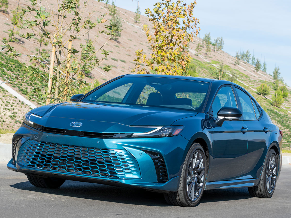 2025 Toyota camry driving on the road.