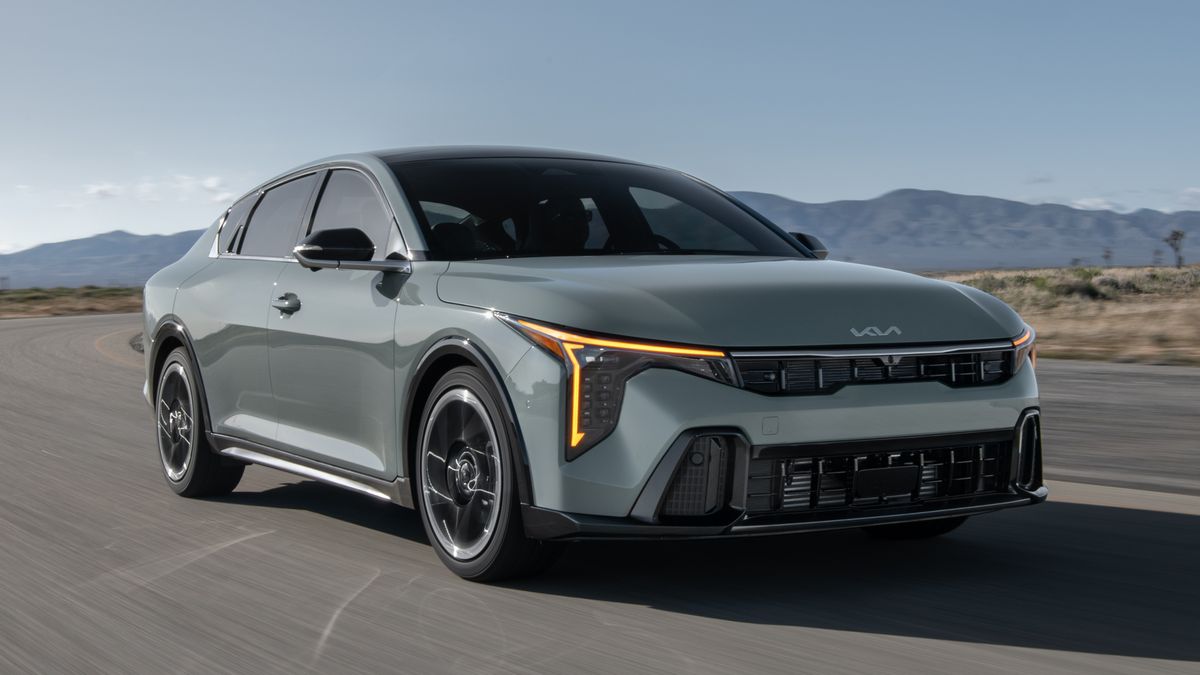 2025 Kia K4 driving on the road.