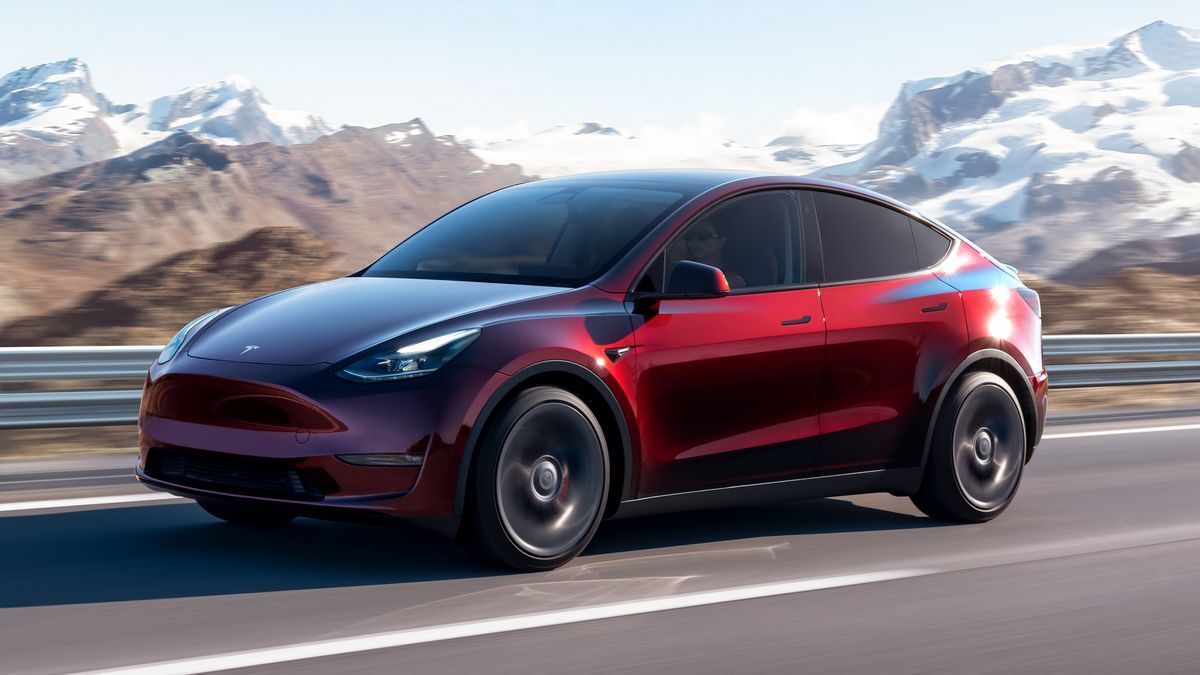 2024-tesla-model-y-red-driving-front-3qtr.jpg