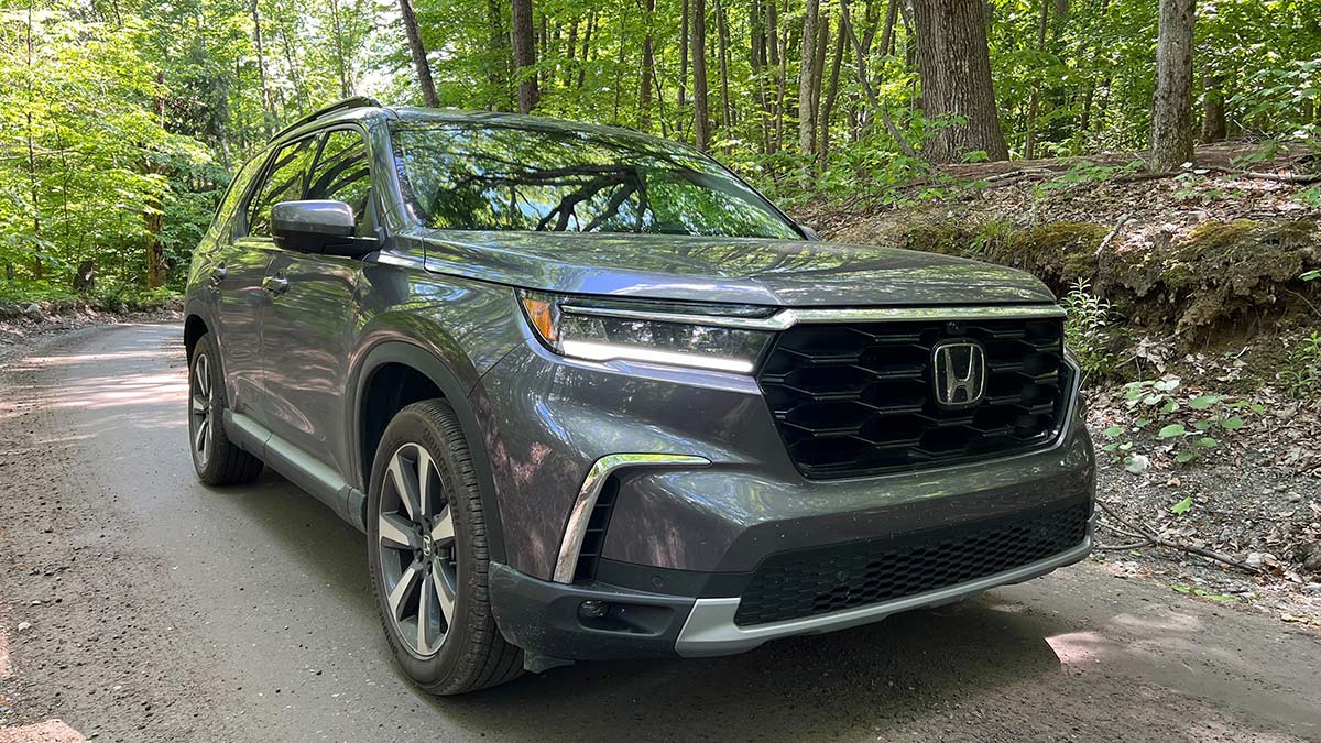 2024 Honda Pilot elite parked in a forest.