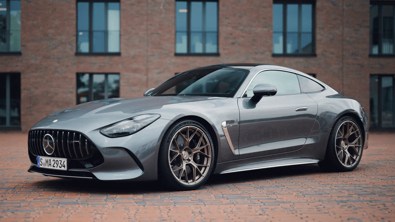 2025 Mercedes-Benz AMG GT63 left-side 3/4 view parked in front of a brick building