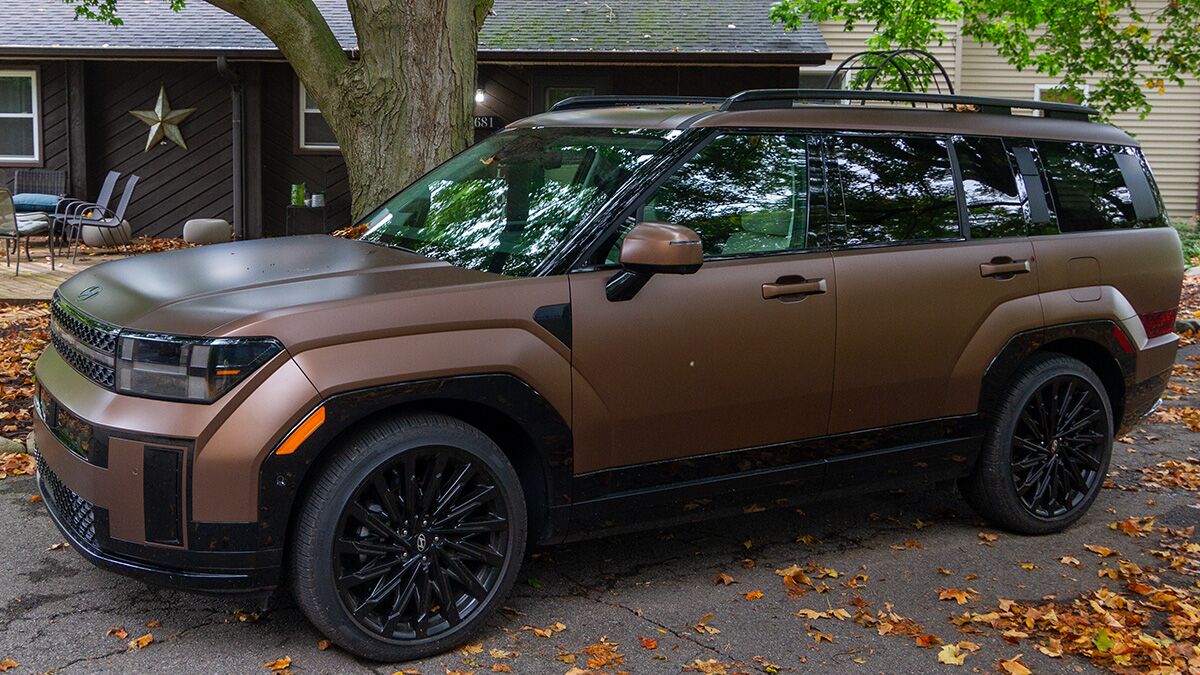 the 2024 Hyundai Santa Fe in brown seen from a front quarter angle