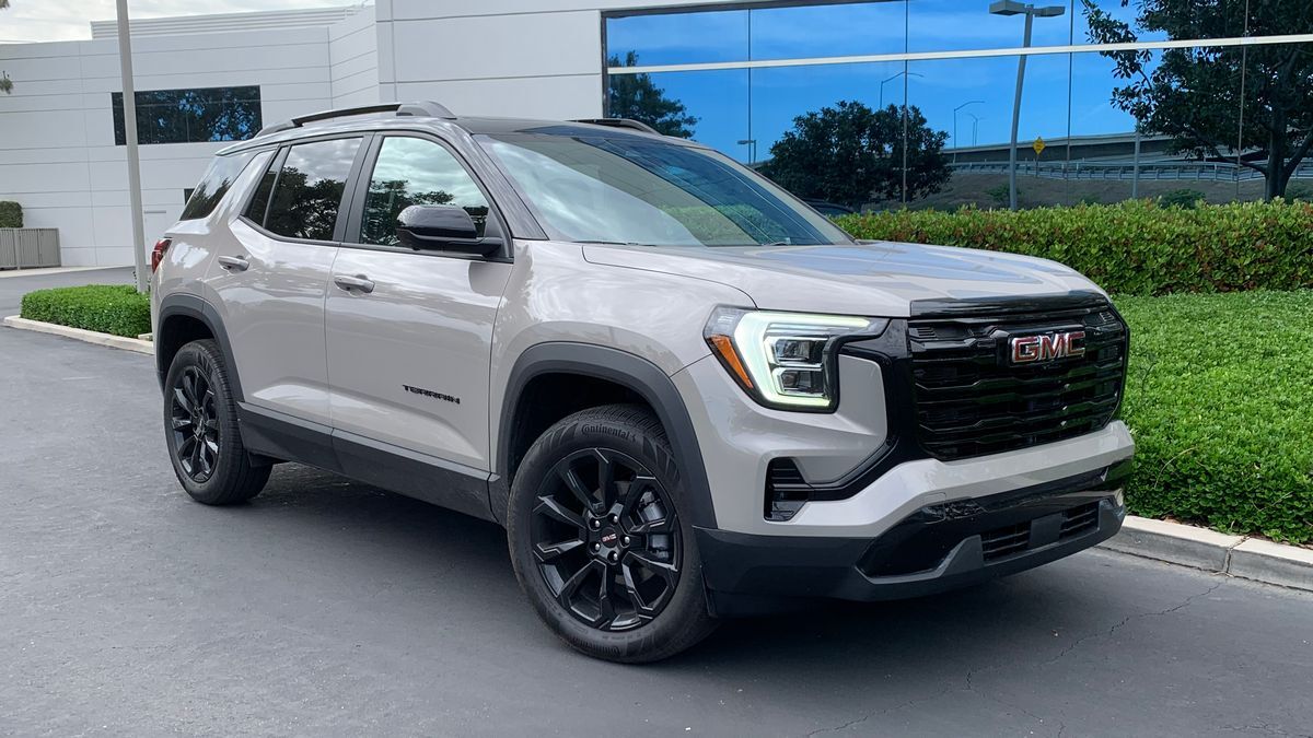 2025 GMC Terrain Elevation in black parked next to a barn.