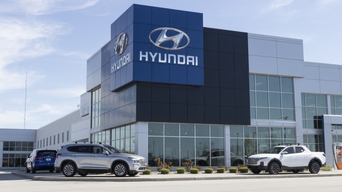 SUVs and trucks parked outside a Hyundai dealership