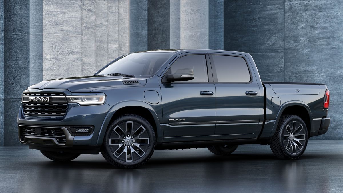 2025 Ram 1500 Ramcharger Tungsten parked near concrete walls.