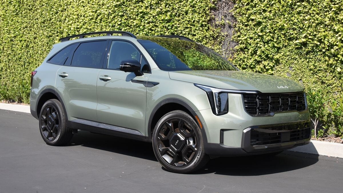 2026 Kia Sorento parked in front of a grass wall.