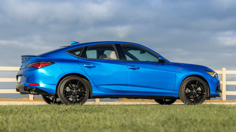 2026 Acura Integra A Spec Tech right side profile view against a cloudy background.