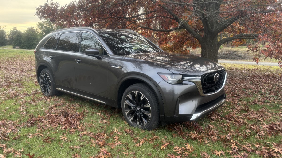 2025 Mazda CX-90 parked on brown leaves on the floor.