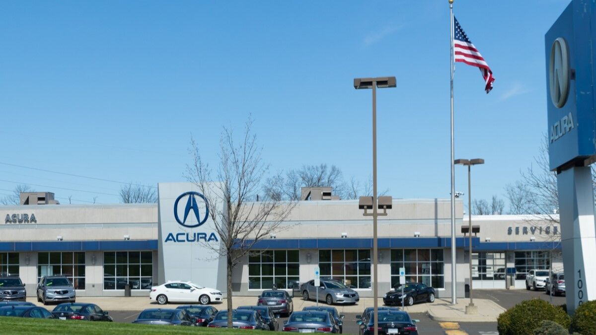 Cars parked outside an Acura dealership
