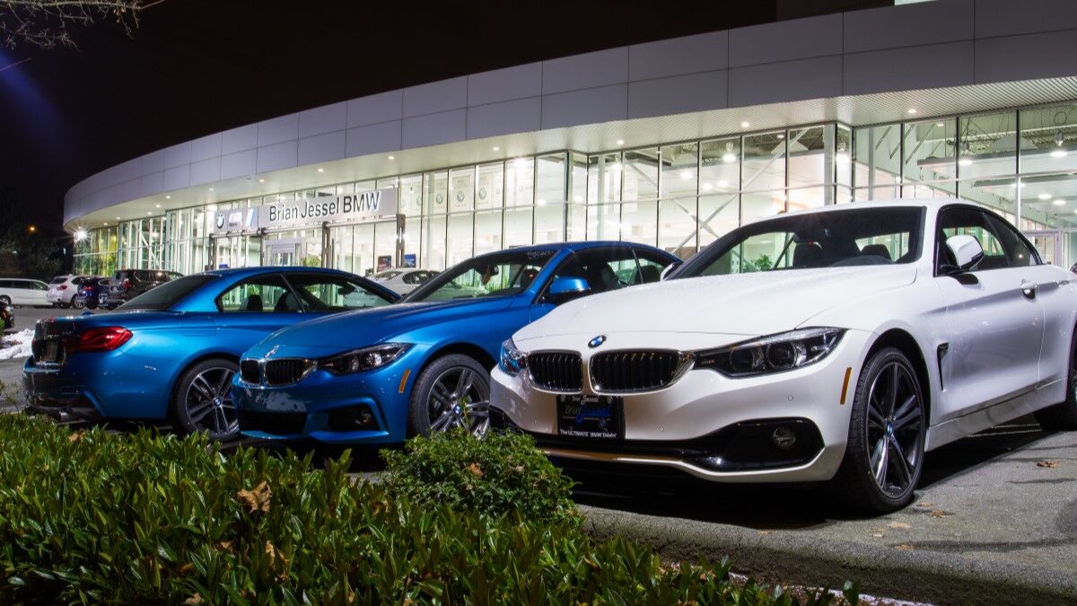 A BMW dealership at night.