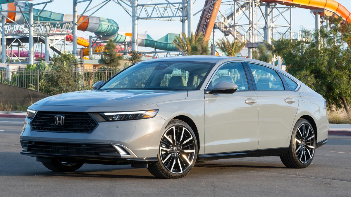 2025 Honda Accord Hybrid parked by a slide.