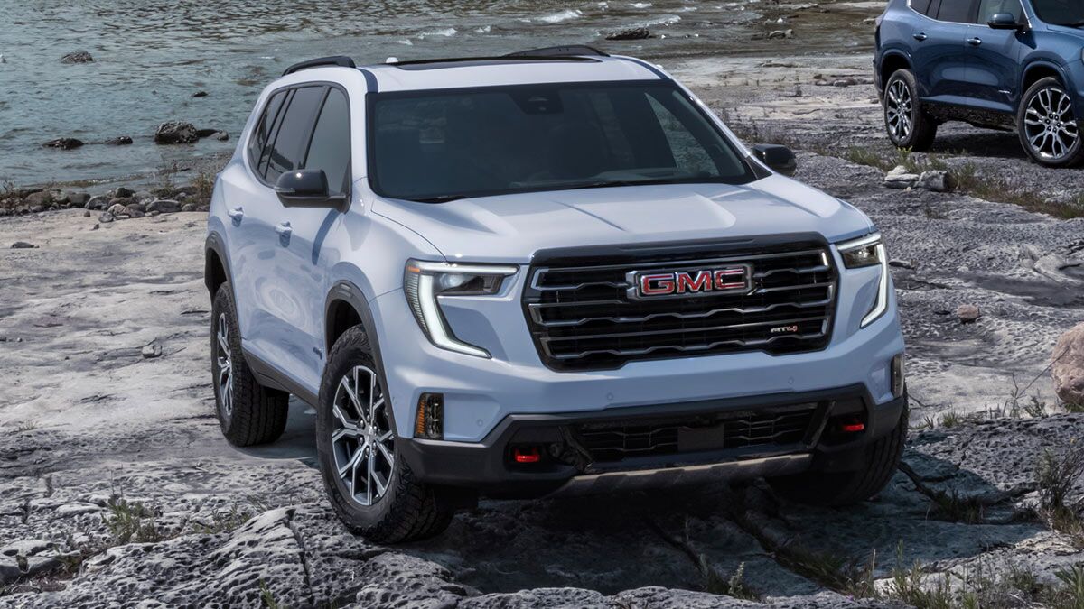 2025 GMC Acadia on a rocky beach.
